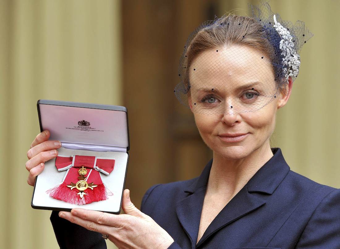 Fashion designer Stella McCartney holds her Officer of the British Empire (OBE) award at Buckingham Palace after the Investiture Ceremony in central London